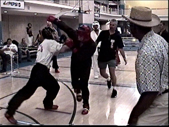 Jesse "NHL" Harter (left) demolishes two opponents on way to the Silver Medal in Heavyweight Point Fighting.  He lost his third fight to Bill Hunter, NBL Commissioner in a close 5-3 match.