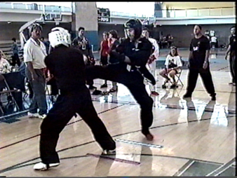 Jesse Harter (right), is rated #3 in the Pacific Northwest for NBL Point Fighting and #1 for Continuous Fighting, he is fighting Bill Hunter, who is rated #1 in Point Fighting.  Harter took Silver in this division and Hunter took Gold with his trademark "finesse" fight.  Mike Shintaku is the center judge, viewed to the left of Mr. Hunter.