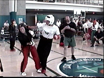 Jessie Smith (right), is rated #1 in Women's NBL Continuous Fighting for the Pacific Northwest, lands a hooking punch to her opponent from Team MADD, Marlene Fargher, who is rated #3 in Lightweight Continuous Sparring for the Western Pacific Conference